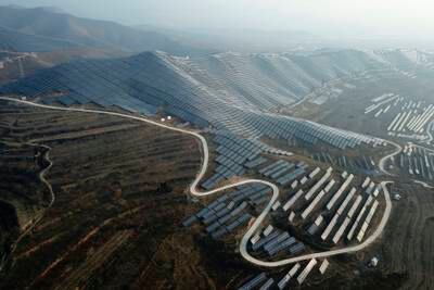 A solar power plant in China's Shanxi Province. China will drive the renewable capacity growth over the coming years, accounting for 43 per cent of global renewable capacity growth, the IEA has said. AP