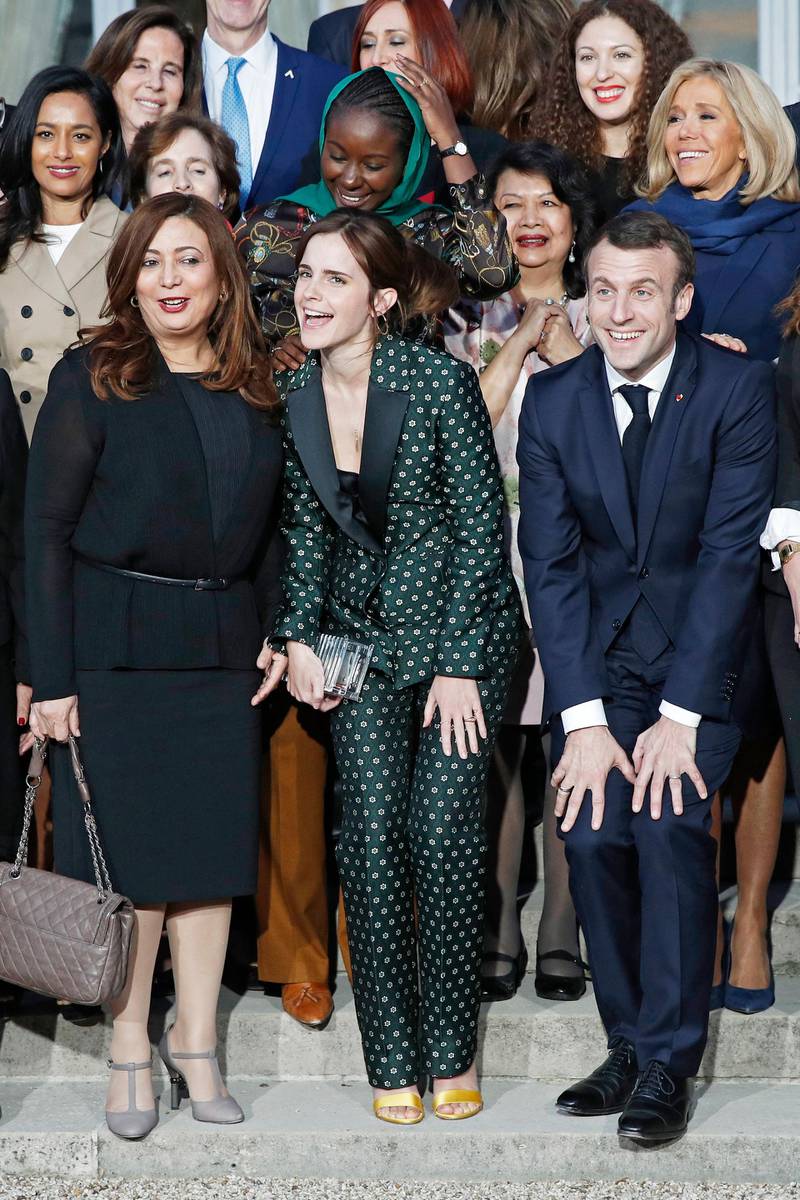 epa07381424 (L-R) British actress Emma Watson, 2015 Nobel prize winner Wided Bouchamaoui and French President Emmanuel Macron  pose for a family photo following a meeting for Gender Equality at the Elysee Palace, in Paris, France, 19 February 2019. This meeting takes place ahead of the next G7 summit in August 2019 in Biarritz, France.  EPA-EFE/YOAN VALAT