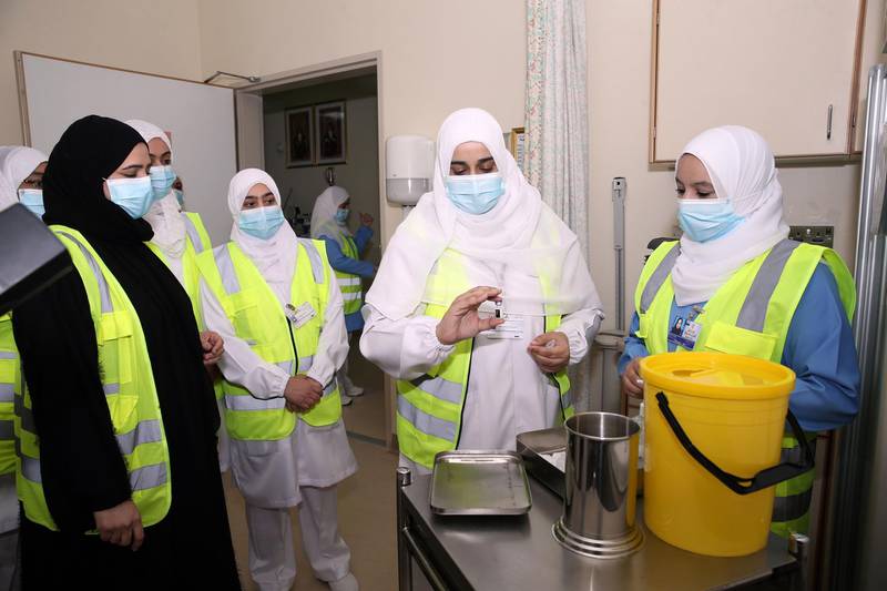 A healthcare worker prepares to administer the Pfizer-BioNTech Covid-19 vaccine in the Omani capital Muscat.  AFP