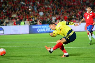 Colombia’s James Rodriguez shoots and scores the 1-1 equaliser on Thursday night against Chile in their 2018 World Cup qualifying match. Martin Bernetti / AFP