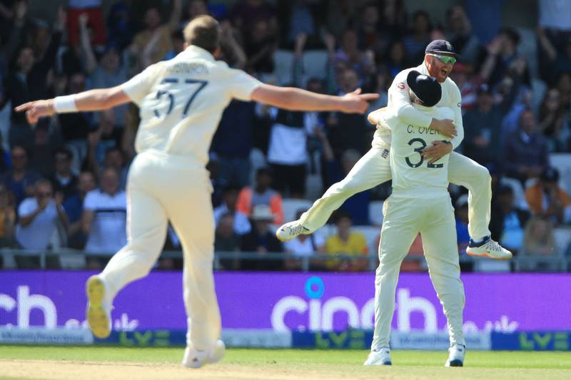 England's Jonny Bairstow leaps into the arms of Craig Overton after he takes the catch to dismiss India's Rishabh Pant off the bowling of Ollie Robinson. AFP
