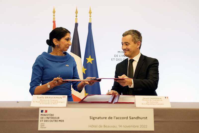 UK Home Secretary Suella Braverman signs the deal with French Interior Minister Gerald Darmanin in Paris. PA