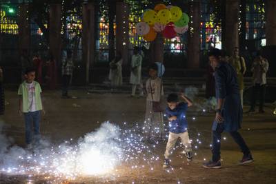People light fire crackers during Diwali in Mumbai. AP