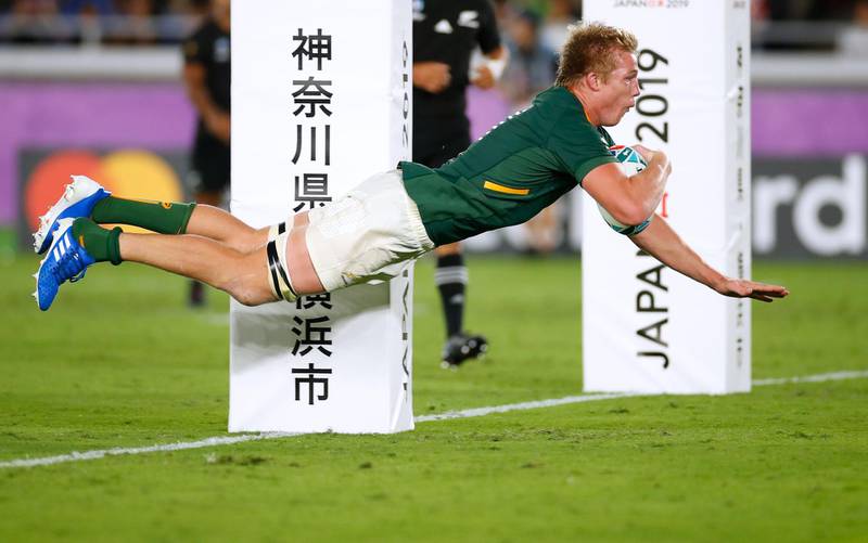 South Africa's flanker Pieter-Steph Du Toit dives and scores a try during the Japan 2019 Rugby World Cup Pool B match between New Zealand and South Africa at the International Stadium Yokohama in Yokohama.  AFP