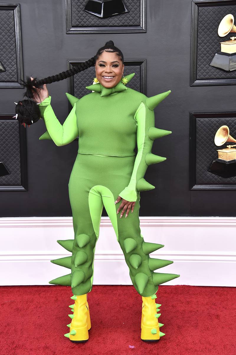 Tayla Parx, wearing a green jumpsuit with foam spikes. AP