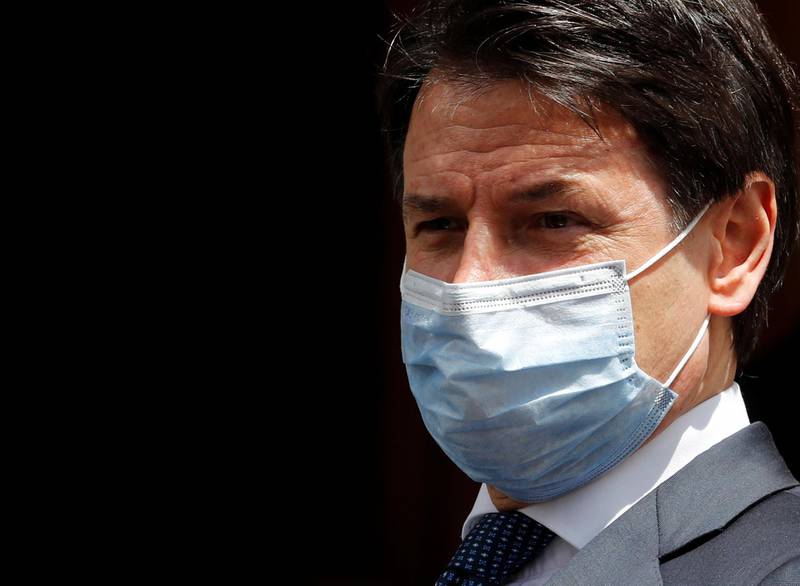 Italian Prime Minister Giuseppe Conte wearing a protective face mask, leaves the Senate as the spread of the coronavirus disease (COVID-19) continues, in Rome, Italy May 20, 2020. REUTERS/Remo Casilli
