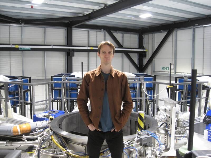 Dr Nick Hawker, First Light Fusion's co-founder and chief executive, in front of M3 (Machine 3) at the company's headquarters in Kidlington, Oxfordshire. Daniel Bardsley for The National