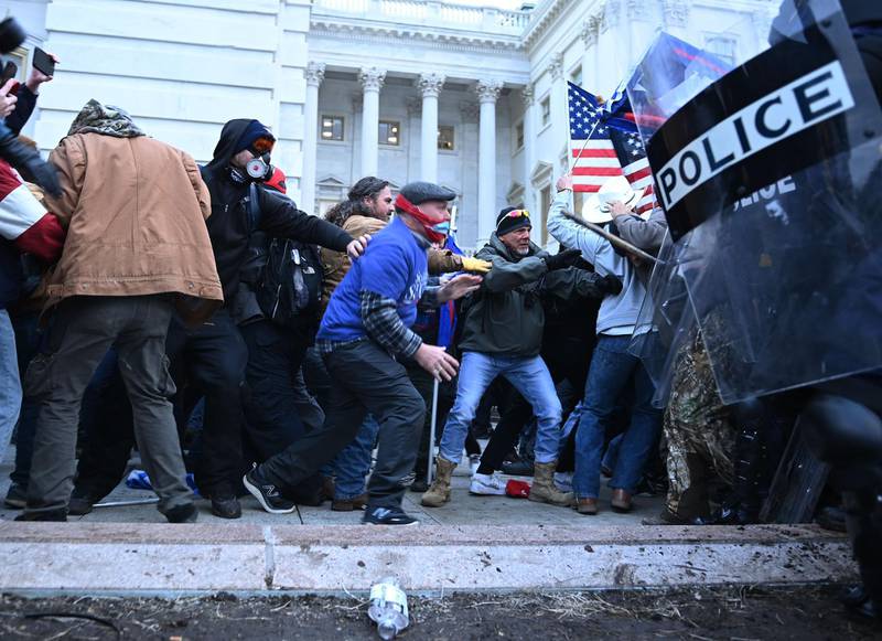 Trump supporters clash with police and security forces, as they storm the US Capitol. AFP