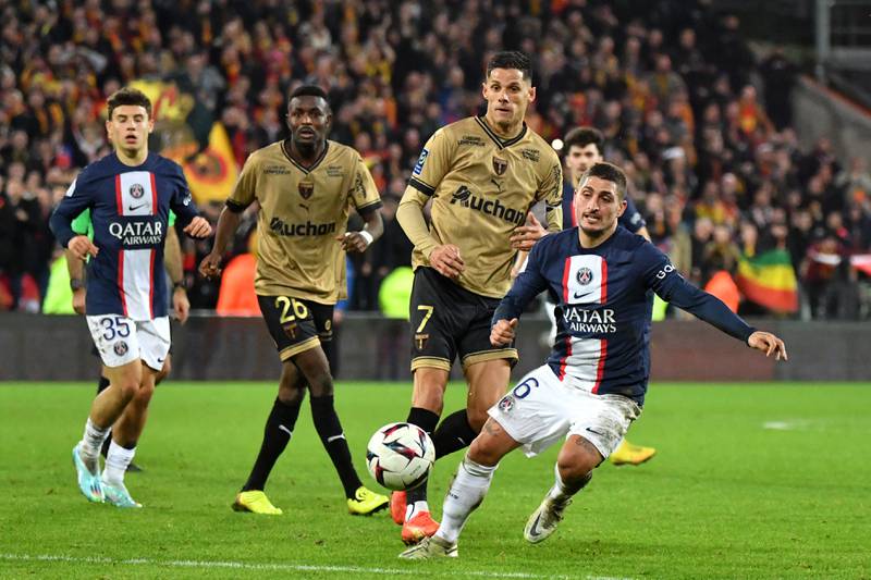 Paris Saint-Germain's Italian midfielder Marco Verratti, right, runs with the ball. AFP
