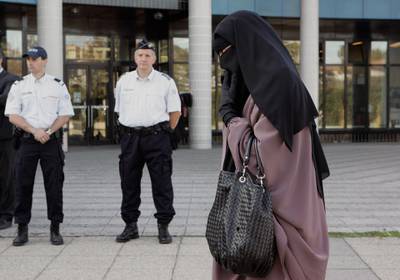 MEAUX, FRANCE - SEPTEMBER 22:  Hind Ahmas, 32, leaves the court after being convicted as the first woman wearing a niqab after France's nationwide ban on the wearing of face veils on September 22, 2011 in Meaux, France. Hind Ahmas, 32, was fined 120 Euros and Najate Nait Ali 80 Euros after breaking the newly implemented French law. Belgium, Italy, Denmark, Austria, the Netherlands and Switzerland either have or are considering the banning of full-face veils.  France was the first European country to ban women from wearing them in public. (Photo by Franck Prevel/Getty Images)
