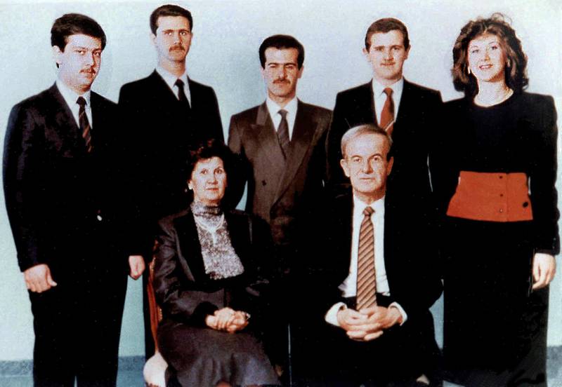 A family picture dated 1985 shows Syrian President Hafez al-Assad and his wife Anissah Makhlouf (seated) and, behind them, from R to L their five children: Bushra, born in 1960,  Majd, born in 1967, Bassel (1962-94), Bashar, 1965, and the youngest, Maher, 1968. (Photo by - / AFP)