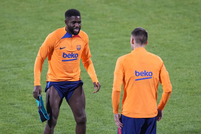 Barcelona's Samuel Umtiti, left, and Clement Lenglet warm up. AP Photo