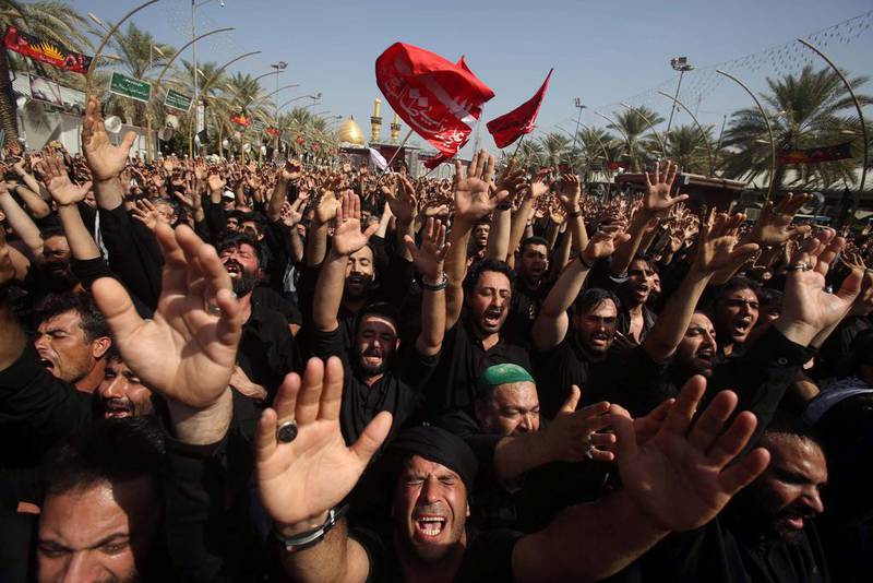 Iraqi Shiites take part in commemorations on the 10th day of Muharram, in Karbala. Mohammed Sawaf / AFP