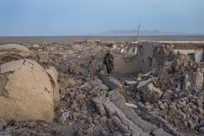 Taliban fighters at the site of an earthquake in Herat province, Afghanistan. AP