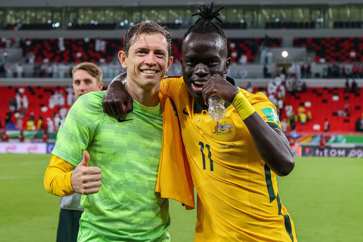 Australia's Craig Goodwin and Awer Mabil celebrate after beating the UAE in their World Cup play-off qualifier. AFP
