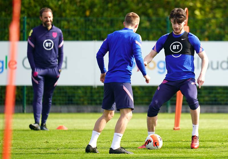 England manager Gareth Southgate watches Declan Rice and James Ward-Prowse during training. PA