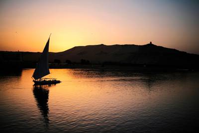 A pleasure boat carrying tourists and locals sails on the Nile at sunset in Aswan, Egypt. AP, file