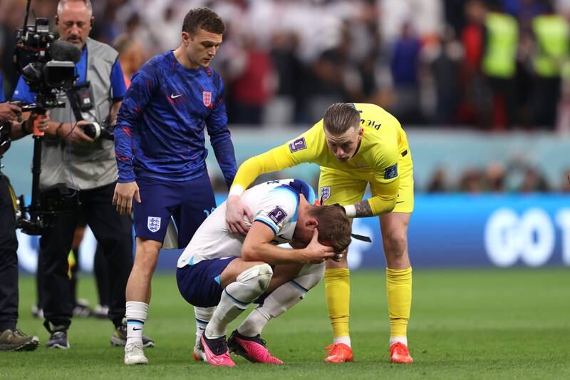 Kane is consoled by Pickford and Kieran Trippier. Getty