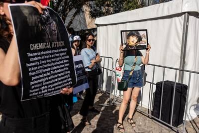 A protester in Federation Square, Melbourne, holds a photo of Iranian girl Nika Shakarami, who was found dead after going missing during protests in Tehran in 2022. EPA