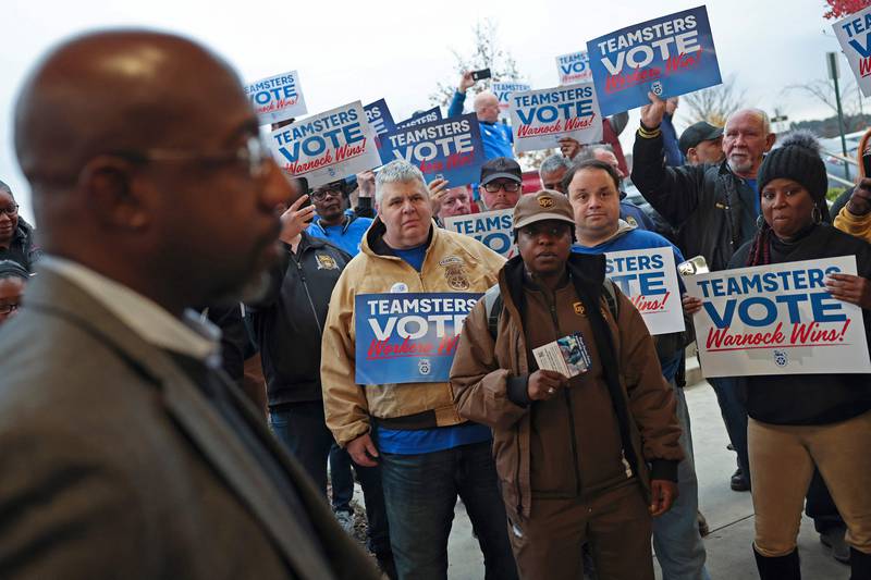 Members of the Teamsters in Georgia come out in support of Mr Warnock in the final full day of campaigning. Getty Images / AFP