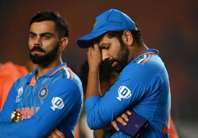 Rohit Sharma of India, right, looks dejected after losing the Cricket World Cup final to Australia. Getty