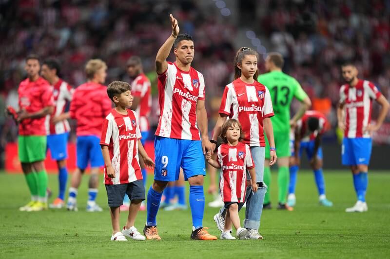Luis Suarez applauds the crowd alongside his children following match between Atletico Madrid and Sevilla at Estadio Wanda Metropolitano on May 15, 2022 in Madrid, Spain. Getty