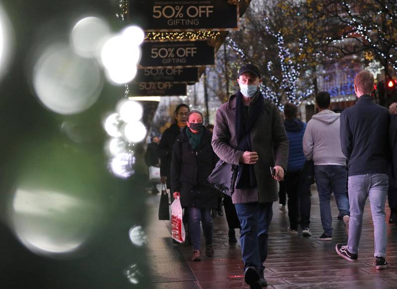 Shoppers walk down Oxford Street in London. Reuters