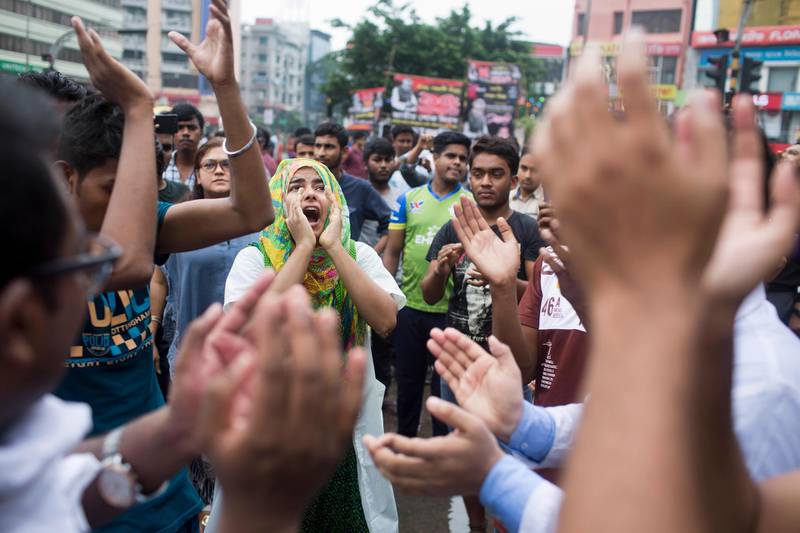 Bangladeshi students shout slogans as they block a road during a protest in Dhaka, Bangladesh. AP Photo / A. M. Ahad
