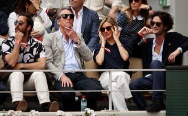 PARIS, FRANCE - JUNE 05: Actors Hugh Grant and Sienna Miller are seen in the stands during the Men's Singles Final match between Rafael Nadal of Spain and Casper Ruud of Norway on Day 15 of The 2022 French Open at Roland Garros on June 05, 2022 in Paris, France. (Photo by Adam Pretty / Getty Images)