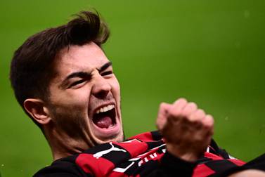 AC Milan's Spanish midfielder Brahim Diaz celebrates after opening the scoring during the UEFA Champions League round of 16, first leg football match between AC Milan and Tottenham Hotspur on February 14, 2023 at the San Siro stadium in Milan.  (Photo by Marco BERTORELLO  /  AFP)