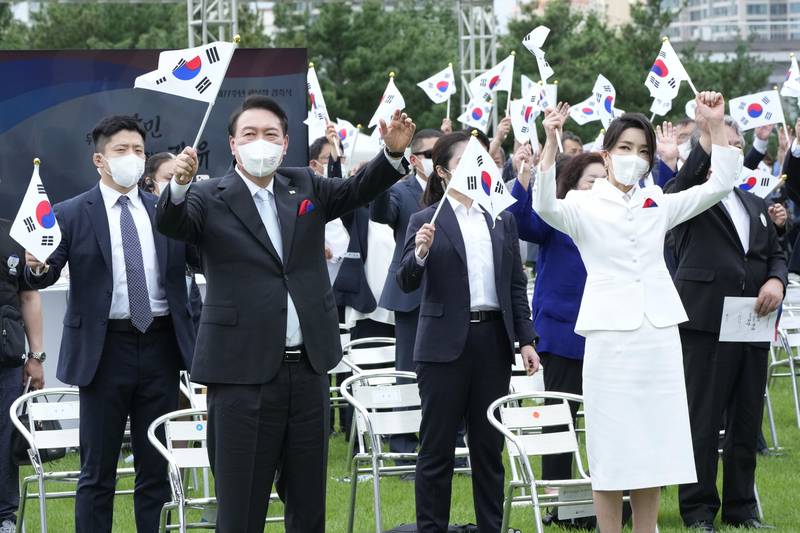 Yoon and Kim cheer during South Korea's 77th National Liberation Day celebrations in Seoul, in August 2022. Getty