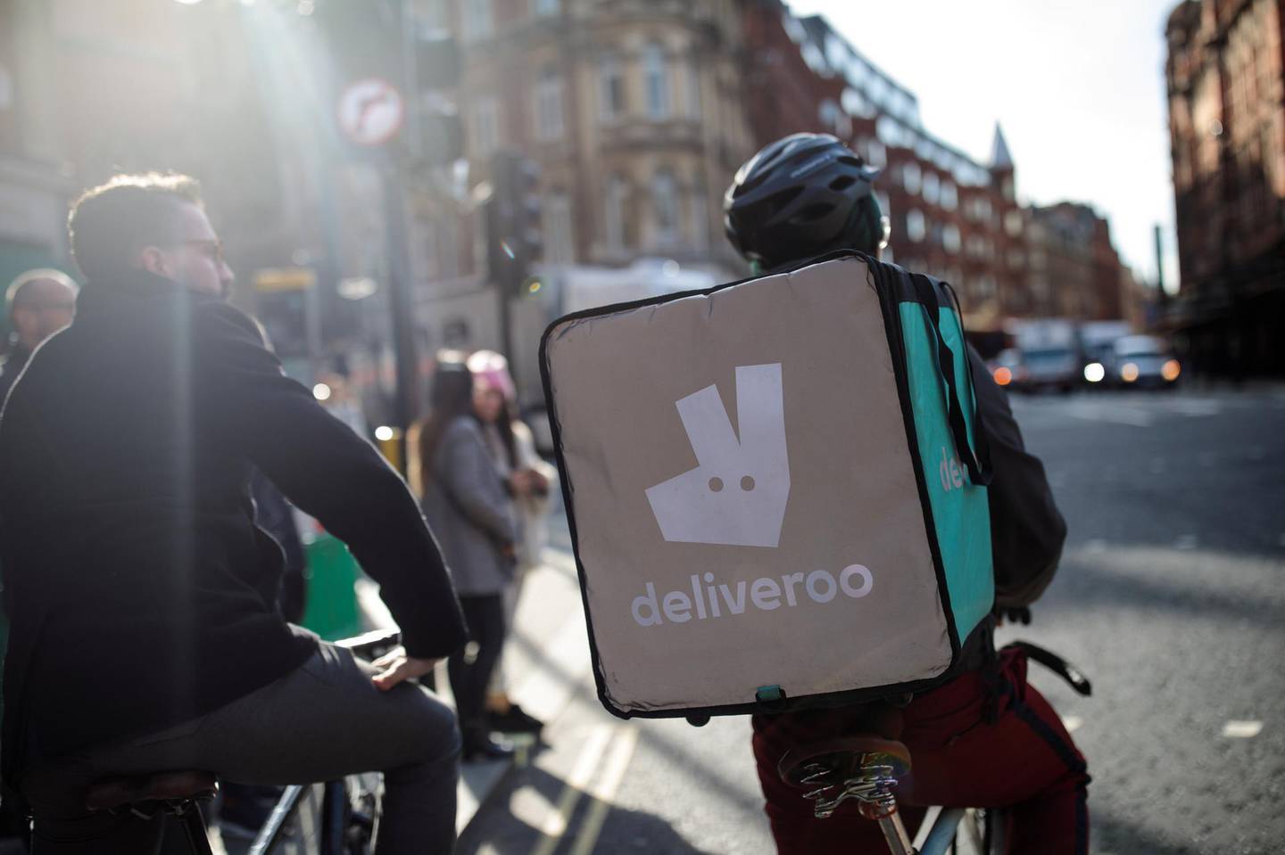 LONDON, ENGLAND - FEBRUARY 16: A Deliveroo rider cycles through central London on February 16, 2018 in London, England. Millions of part-time and flexible workers in the so-called gig economy are to receive new rights including sick and holiday pay under a new government reform. (Photo by Jack Taylor/Getty Images)