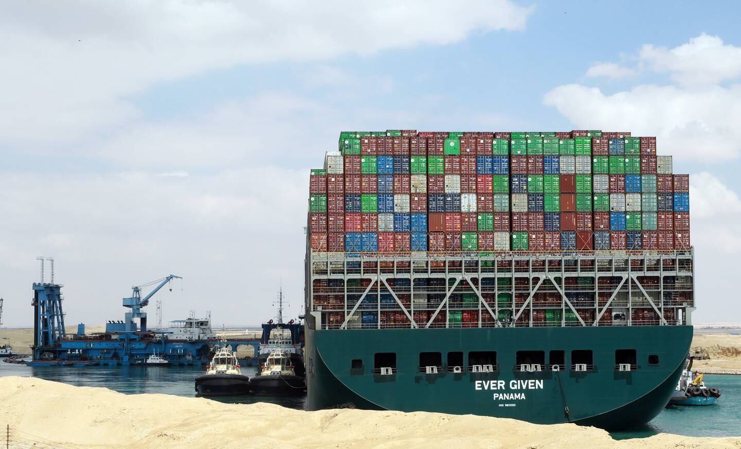 Egyptian tugboats try to pull out the Ever Given container ship stranded in the Suez Canal, Egypt, on March 26 2021. EPA