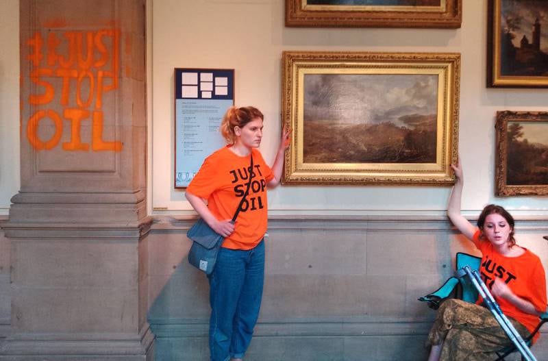 Three young supporters of Just Stop Oil spray-painted around the Kelvingrove Art Gallery and Museum in Glasgow. Two also glued themselves to the frame of Horatio McCulloch's painting 'My Heart’s in the Highlands' on June 29 this year. Photo: Just Stop Oil