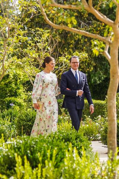 Crown Princess Victoria of Sweden, in a floral By Malina gown, with her husband Prince Daniel