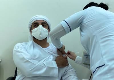 A man receives a dose of a vaccine against the coronavirus disease (COVID-19), in Dubai, United Arab Emirates December 28, 2020. Picture taken December 28, 2020. REUTERS/Abdel Hadi Ramahi