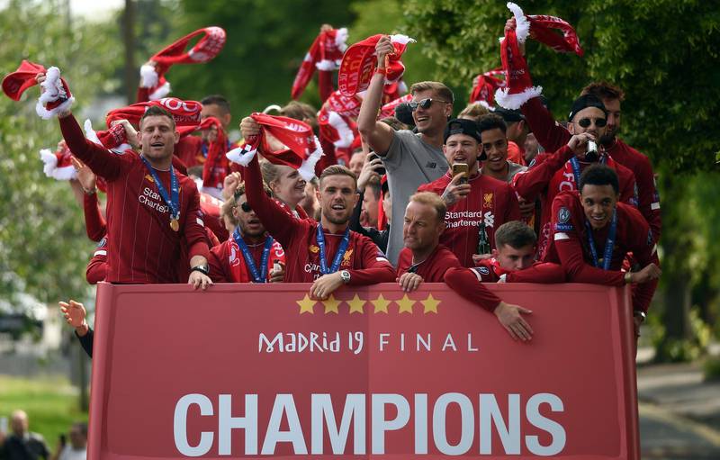 the Liverpool squad on the open top bus parade. AFP