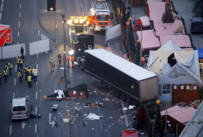 Rescue workers tow the lorry that ploughed into a crowded Christmas market in the German capital on December 20, 2016. Fabrizio Bensch Fabrizio Bensch / Reuters 