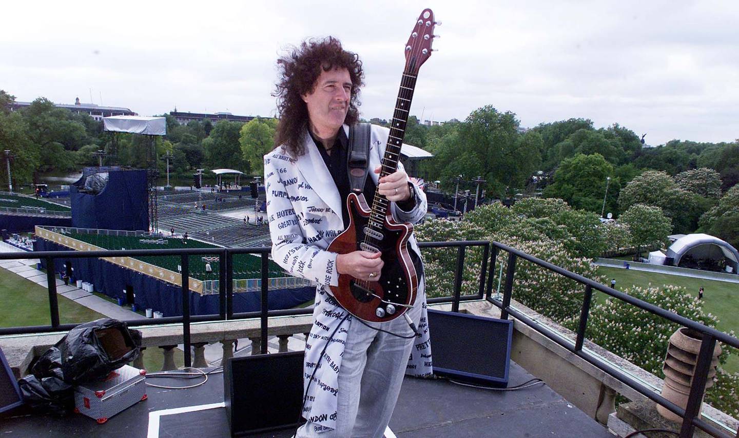 Queen's Brian May rehearsing on the roof of Buckingham Palace ahead of his performance of the national anthem, for Queen Elizabeth II's golden jubilee concert in 2002. PA Wire