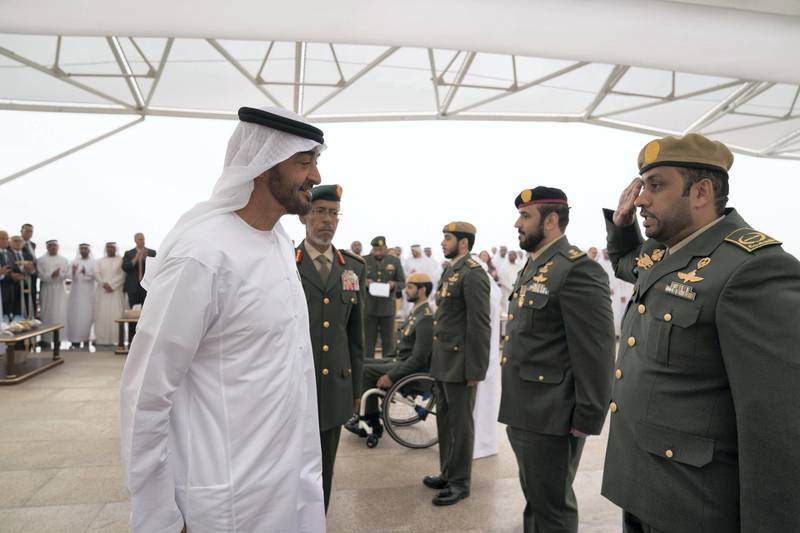 ABU DHABI, UNITED ARAB EMIRATES - April 23, 2018: HH Sheikh Mohamed bin Zayed Al Nahyan Crown Prince of Abu Dhabi Deputy Supreme Commander of the UAE Armed Forces (L), awards a member of the UAE Armed Forces with a Medal of Bravery for his service in Yemen, during a Sea Palace barza

( Mohamed Al Hammadi / Crown Prince Court - Abu Dhabi )
---