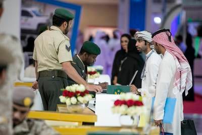 ABU DHABI, UNITED ARAB EMIRATES, Feb. 2, 2015:  
Emirati nationals peruse the GHQ Armed Services stand, checking out and applying for possible jobs, at Tawdheef, a job fair open to UAE citizens only, on Monday, Feb. 2, 2015, at the Abu Dhabi National Exhibition Center.  (Silvia Razgova / The National)  /  Usage: Feb. 2, 2015 /  Section: NA  /  Reporter: Amna

 *** Local Caption ***  SR-150202-Tawdheef12.jpg