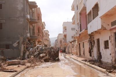 The rushing waters left debris strewn across streets. Islam Alatrash for The National