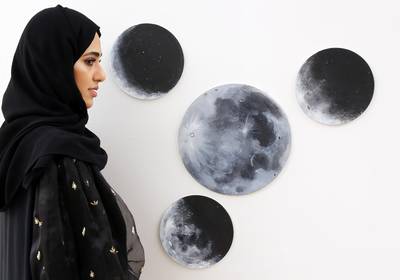 Dubai, 18, Sept,2017 : Artist Hind Khalid pose next to her artwork " Moon Transfornation" duiring the UAE Women in Art exhibition at the Zayed University in Dubai. Satish Kumar / For the National / Story by Nawal Al Ramahi