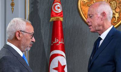 Tunisia's President Kais Saied, right, receives Ennahda leader and parliament speaker Rached Ghannouchi at the presidential palace in November 2019. Tunisian Presidency / AFP