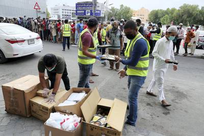 DUBAI, UNITED ARAB EMIRATES , April 28 – 2020 :- 300 packets of cooked food provided by Guru Nanak Darbar (Sikh Temple in Jebel Ali) for the needy and distributed by the Markaz volunteers before the Iftar time during the Ramadan at the Naif area in Deira Dubai. (Pawan Singh / The National) For News/Standalone/Online