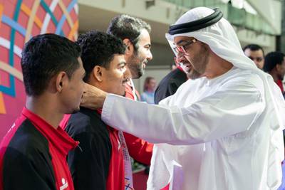 ABU DHABI, UNITED ARAB EMIRATES - March 18, 2019: HH Sheikh Mohamed bin Zayed Al Nahyan, Crown Prince of Abu Dhabi and Deputy Supreme Commander of the UAE Armed Forces (R) presents a medal to an athlete during the Special Olympics World Games Abu Dhabi 2019, at Abu Dhabi National Exhibition Centre (ADNEC).

( Ryan Carter / Ministry of Presidential Affairs )?
---