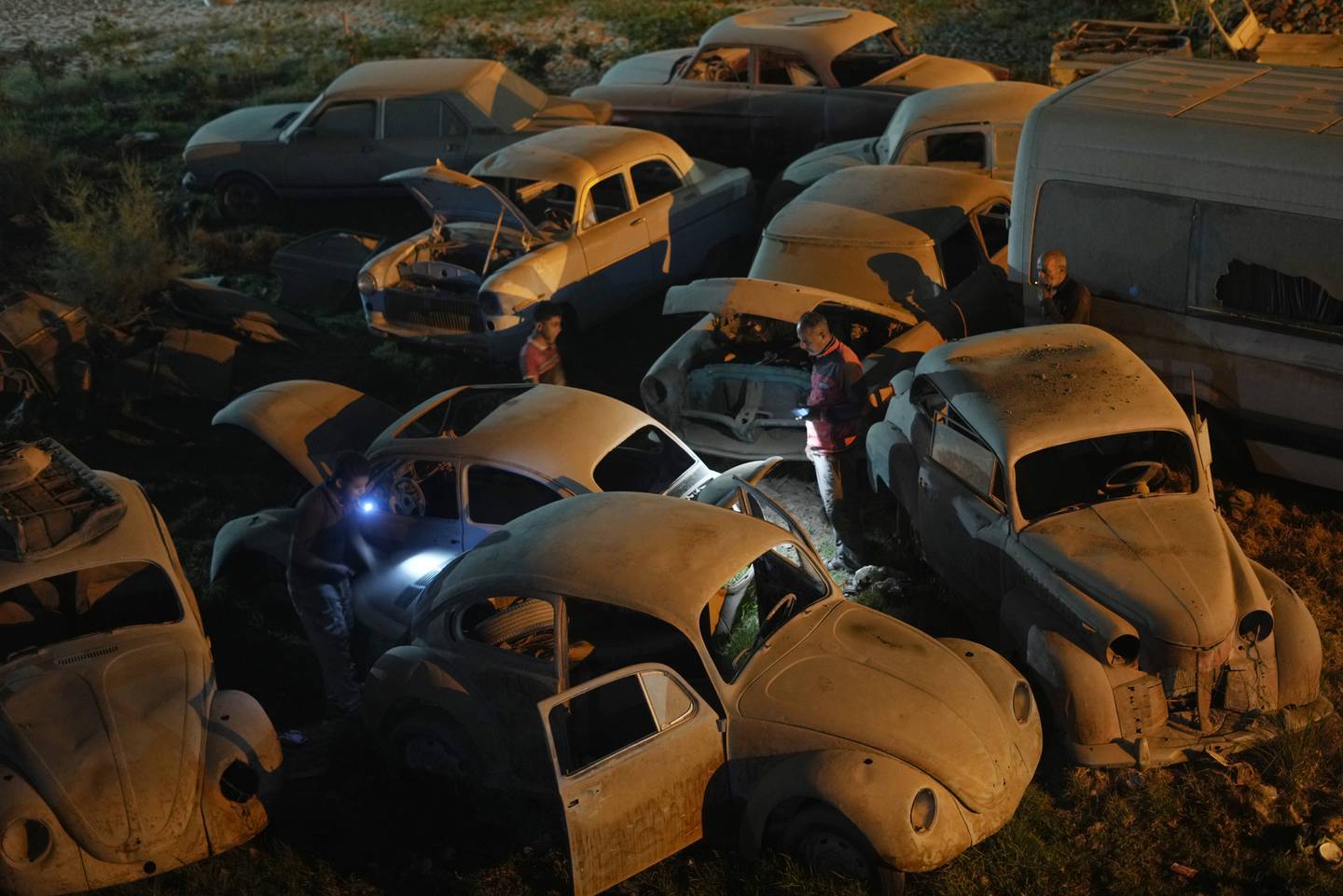 Mechanics select cars for restoration at a lot in El Saff outside Cairo, Friday, April 8, 2022.  Egyptian classic car collector Mohamed Wahdan says he has accumulated more than 250 vintage, antique and classic cars over the past 20 years. AP Photo