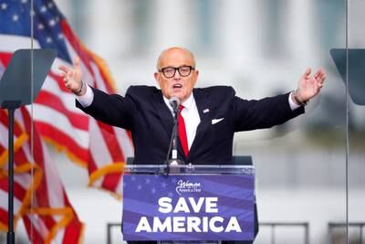FILE PHOTO: U.S. President Donald Trump's personal lawyer Rudy Giuliani gestures as he speaks as Trump supporters gather by the White House ahead of his speech to contest the certification by the U.S. Congress of the results of the 2020 U.S. presidential election in Washington, U.S, January 6, 2021. REUTERS/Jim Bourg/File Photo