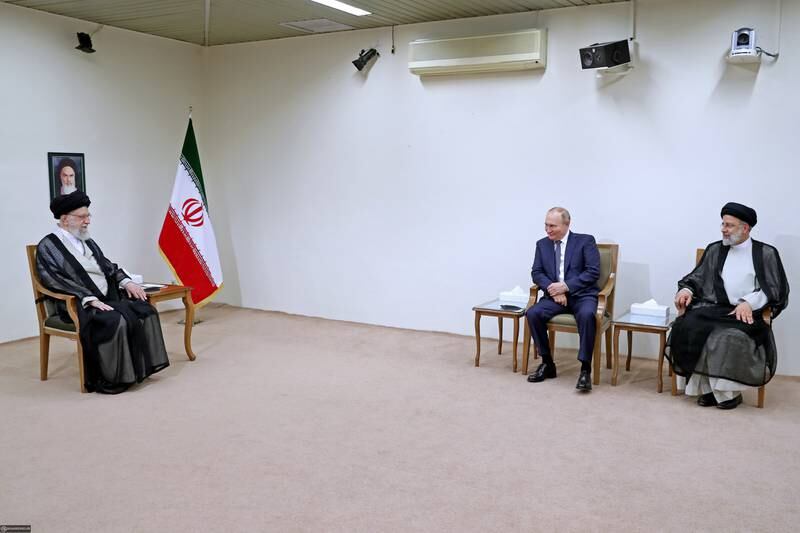 Iranian supreme leader Ayatollah Ali Khamenei holds talks with Mr Putin and Mr Raisi in Tehran. EPA