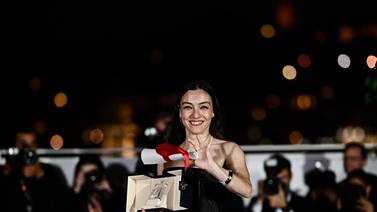 Turkish actress Merve Dizdar poses during after she won the Best Actress Prize. AFP